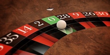 Live casino table with roulette and cards on screen